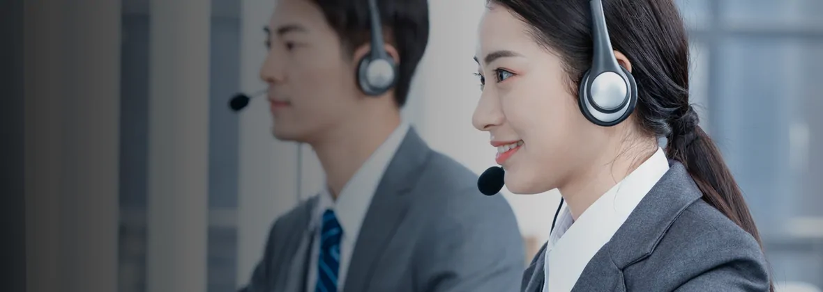 AllChinaBuy support staff wearing headsets at their desks